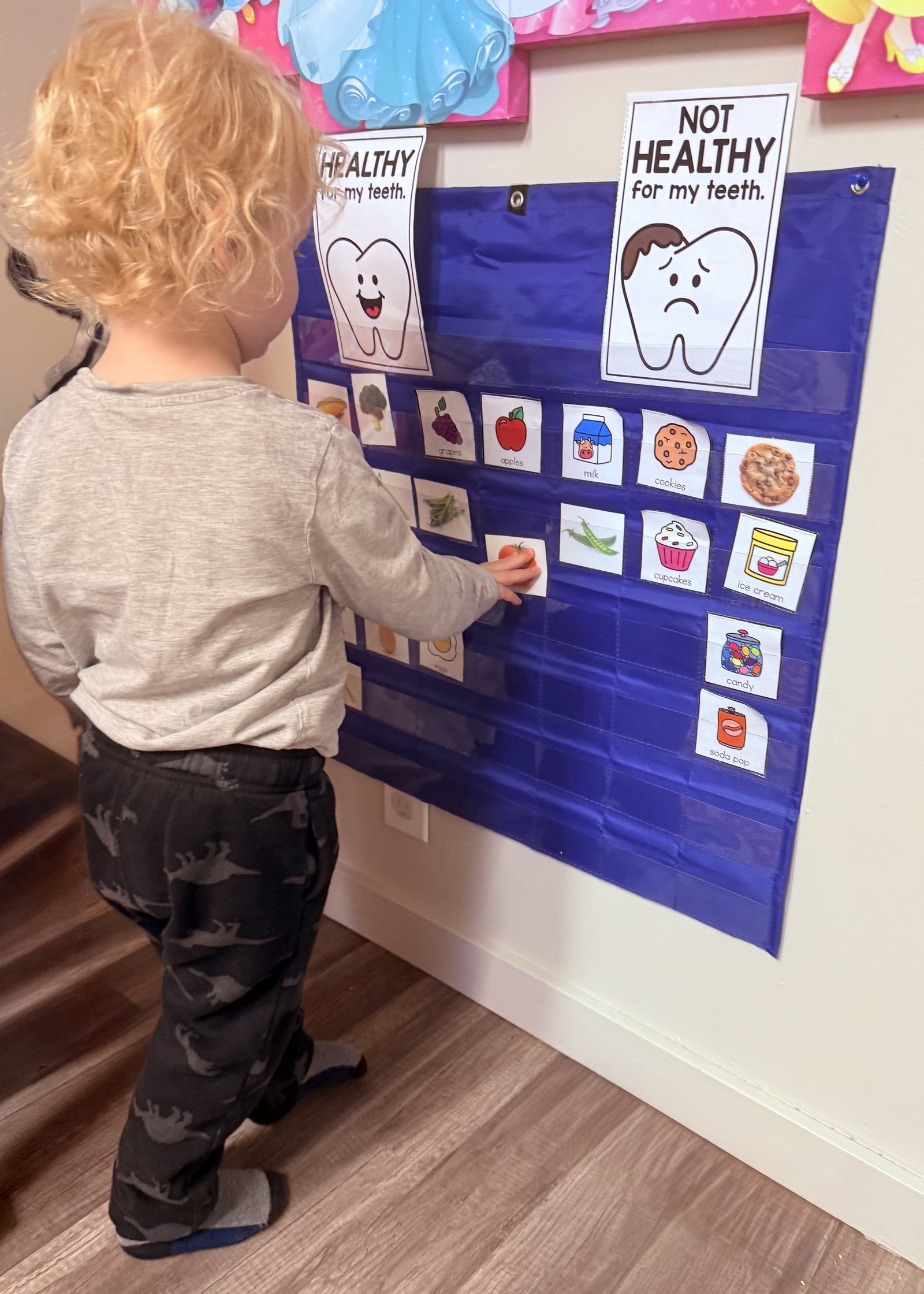 Child learning about healthy foods for teeth